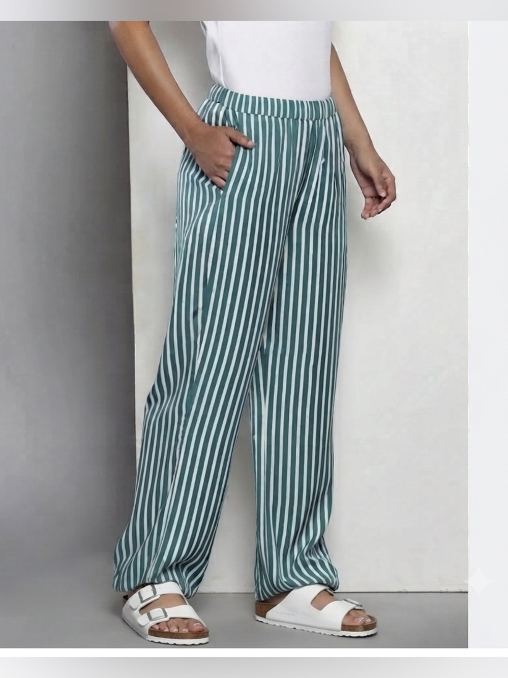 Calvin Klein striped wide-leg pants featuring a green and blue vertical stripe